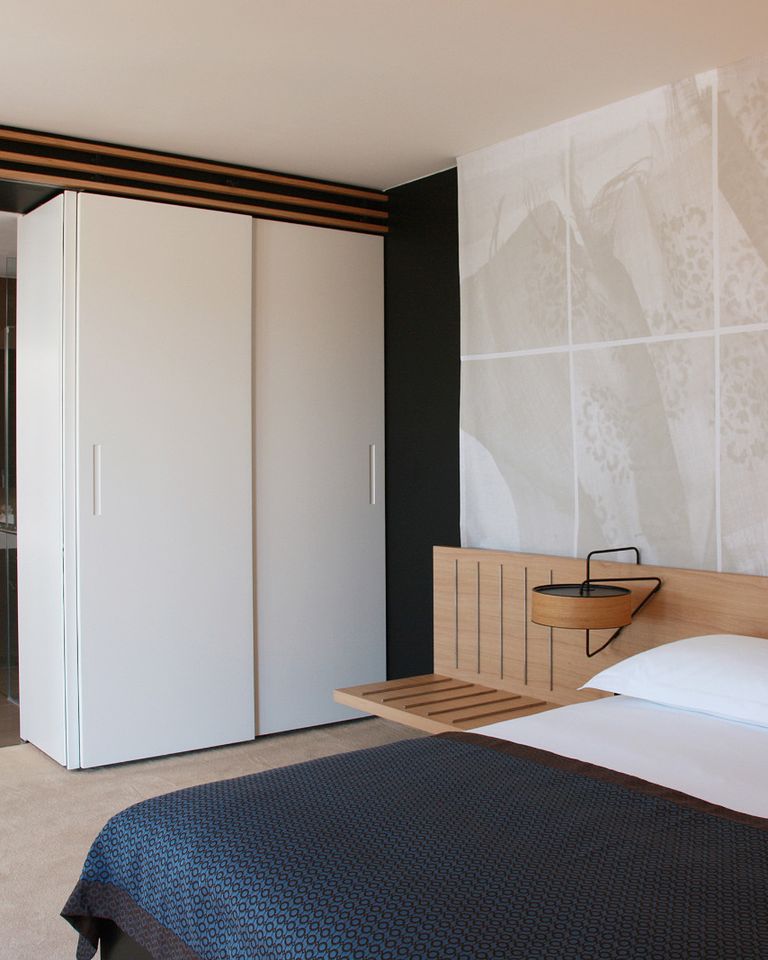 Minimal hotel bedroom with natural light